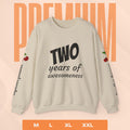 Beige sweatshirt with 'TWO years of awesomeness' text on a peach background