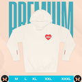 White hoodie with a red heart design on the chest against a pink background with 'PREMIUM' text.