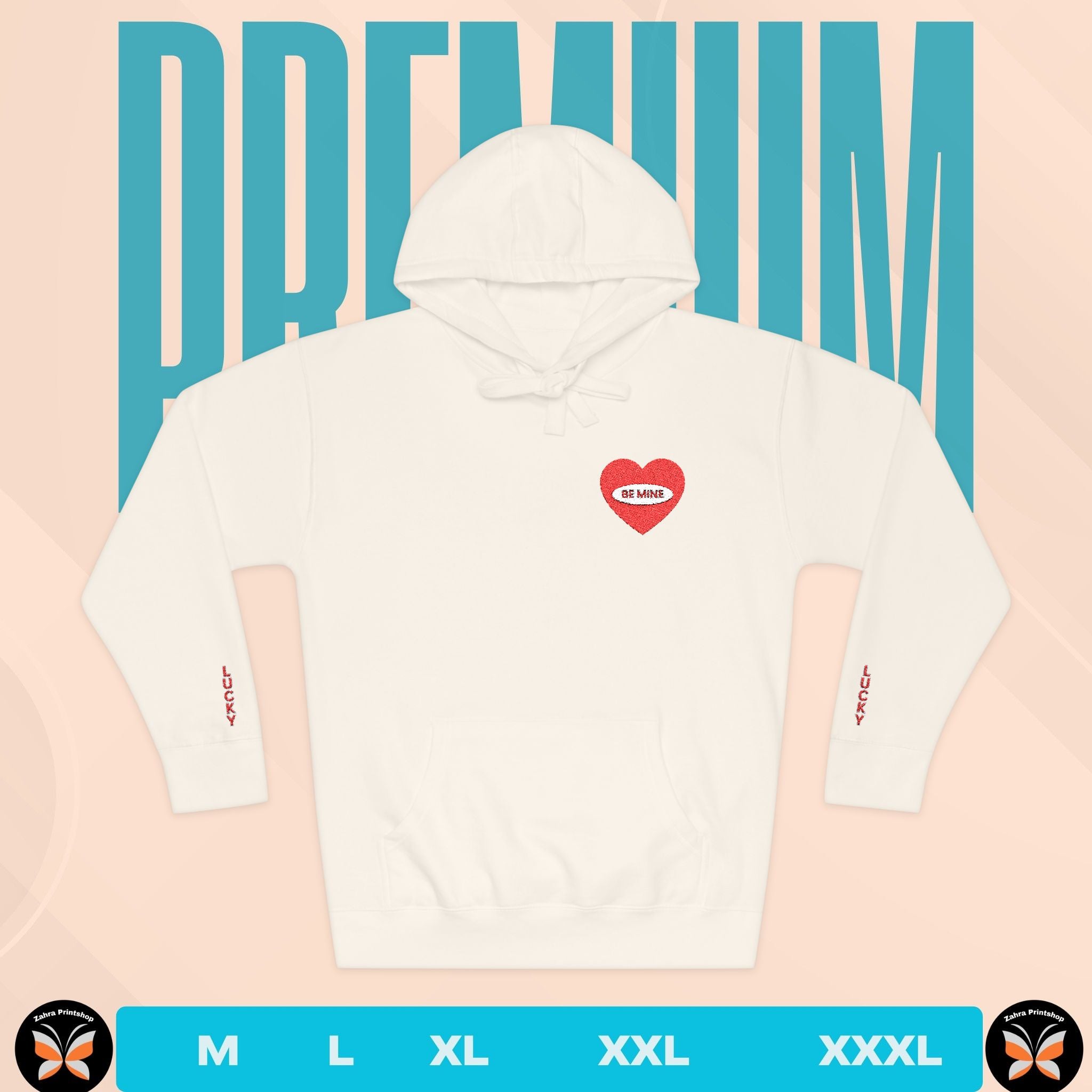 White hoodie with a red heart design on the chest against a pink background with 'PREMIUM' text.
