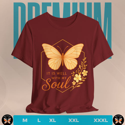 Maroon t-shirt with a yellow butterfly graphic and 'It is well with my soul' text on a beige background.