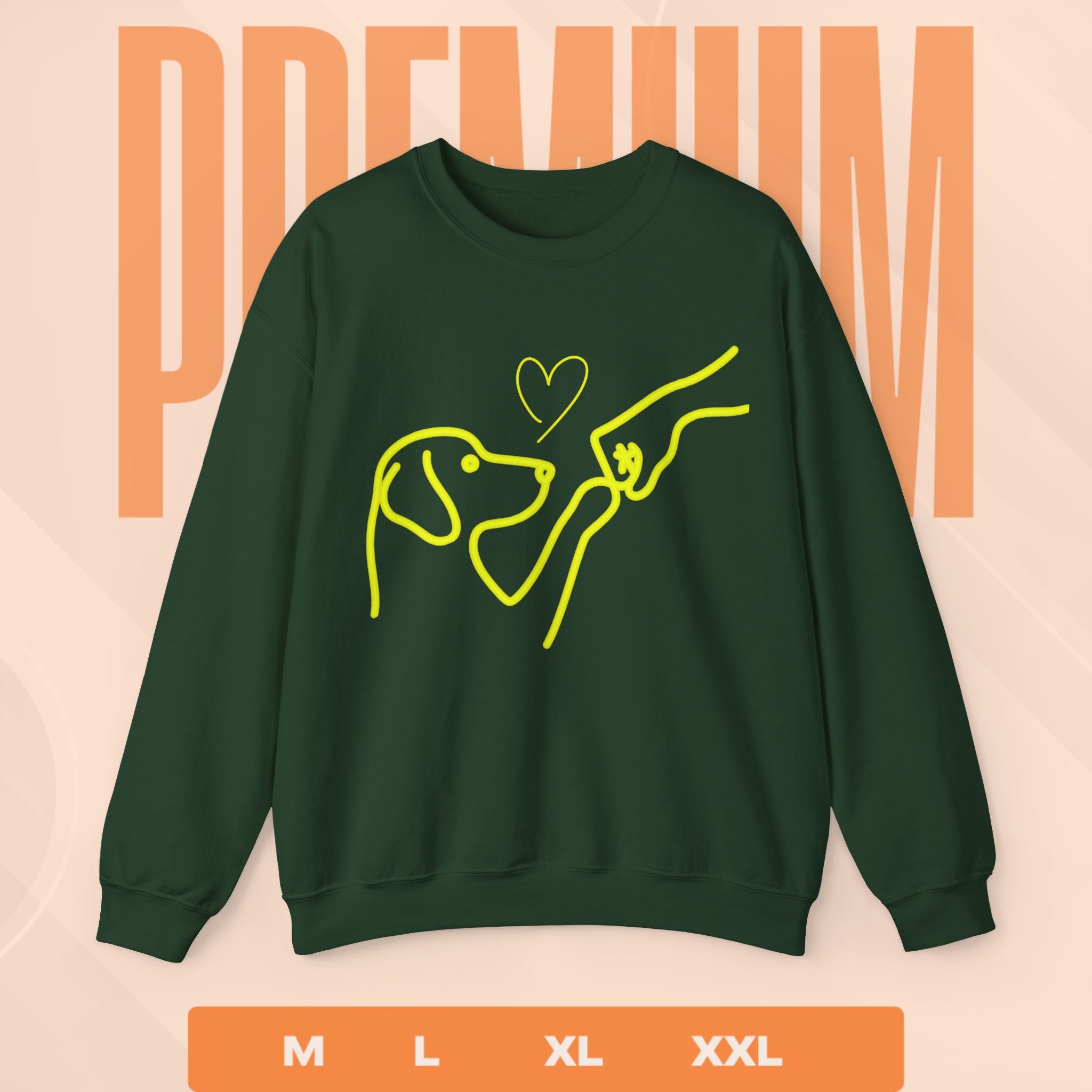 Green sweatshirt with yellow dog and person graphic on a peach background