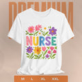 White t-shirt with 'NURSE' text surrounded by colorful flowers on a beige background.