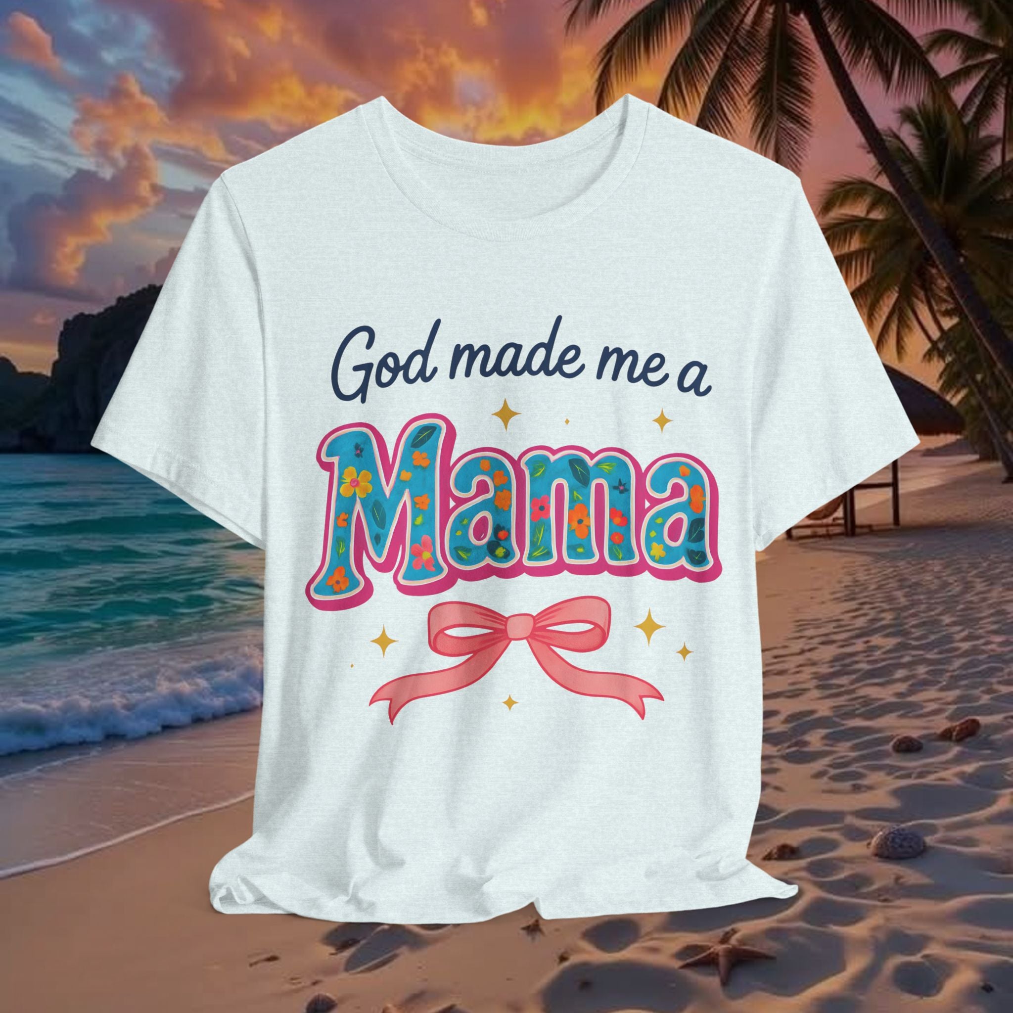 White t-shirt with 'God made me a Mama' text on a beach at sunset
