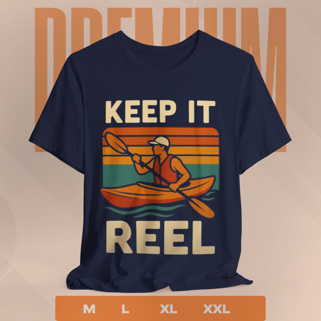 Navy blue t-shirt with a graphic of a person in a kayak and 'Keep It Reel' text on a beige background.