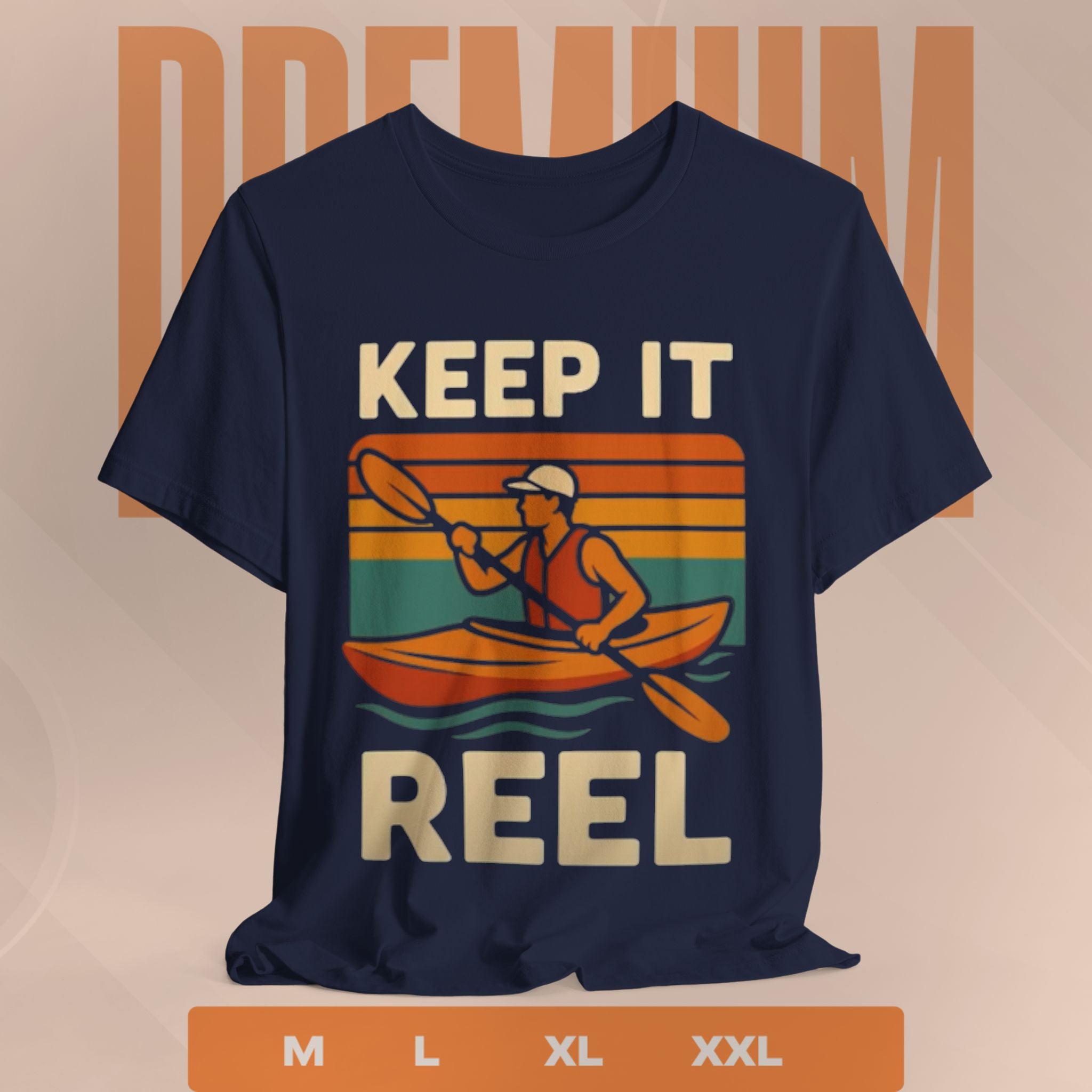 Navy blue t-shirt with a graphic of a person in a kayak and 'Keep It Reel' text on a beige background.