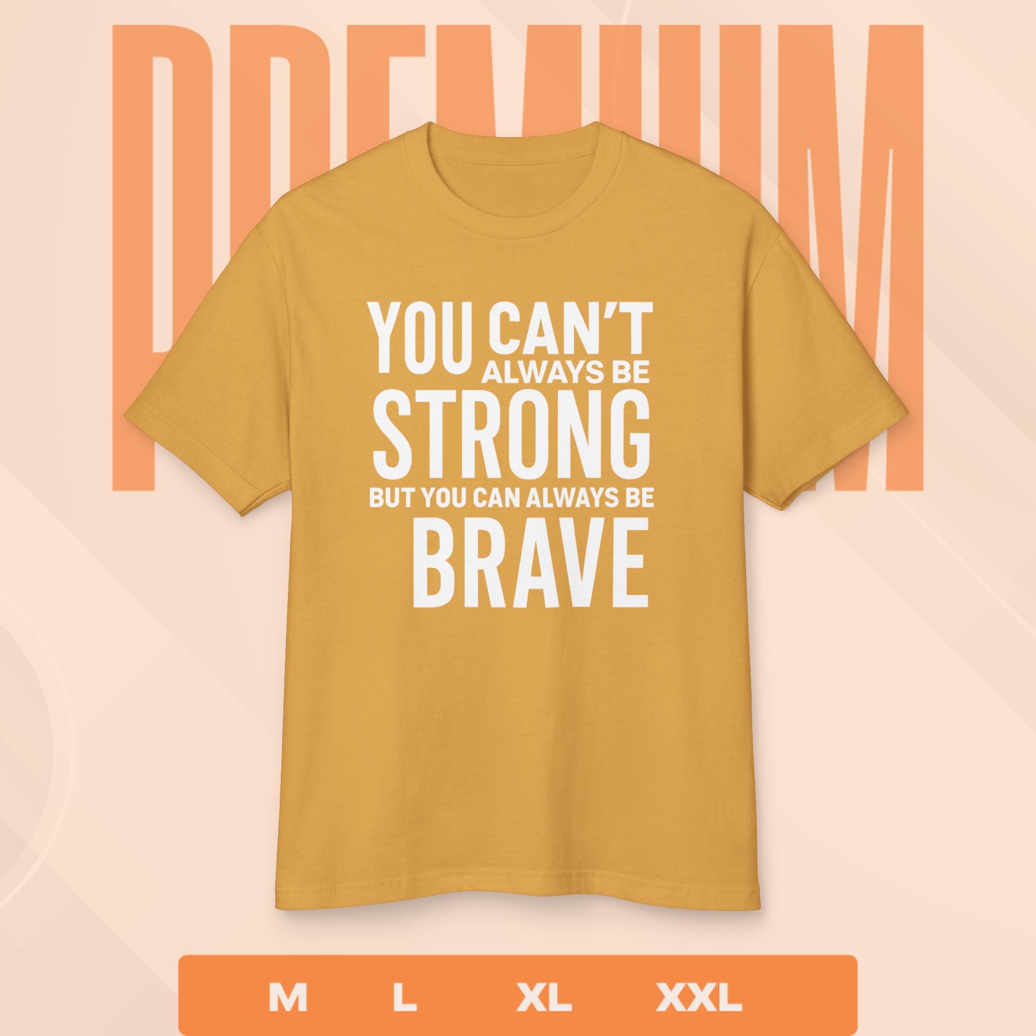 Mustard yellow t-shirt with motivational quote on a peach background