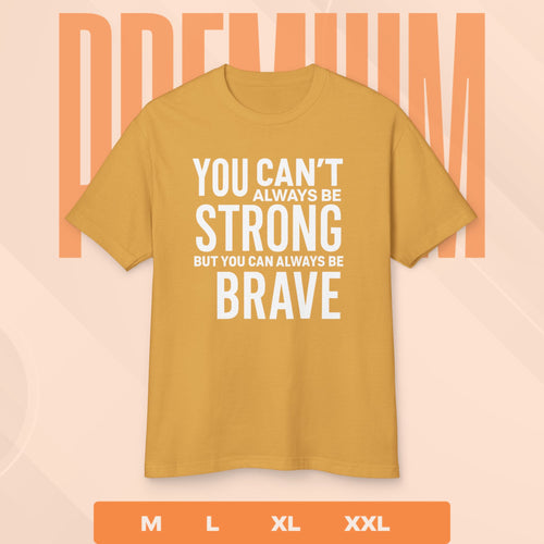 Mustard yellow t-shirt with motivational quote on a peach background