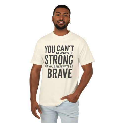 Man wearing a cream t-shirt with motivational text on a white background