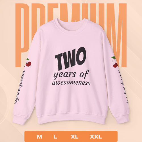 Pink sweatshirt with 'Two years of awesomeness' text on a beige background