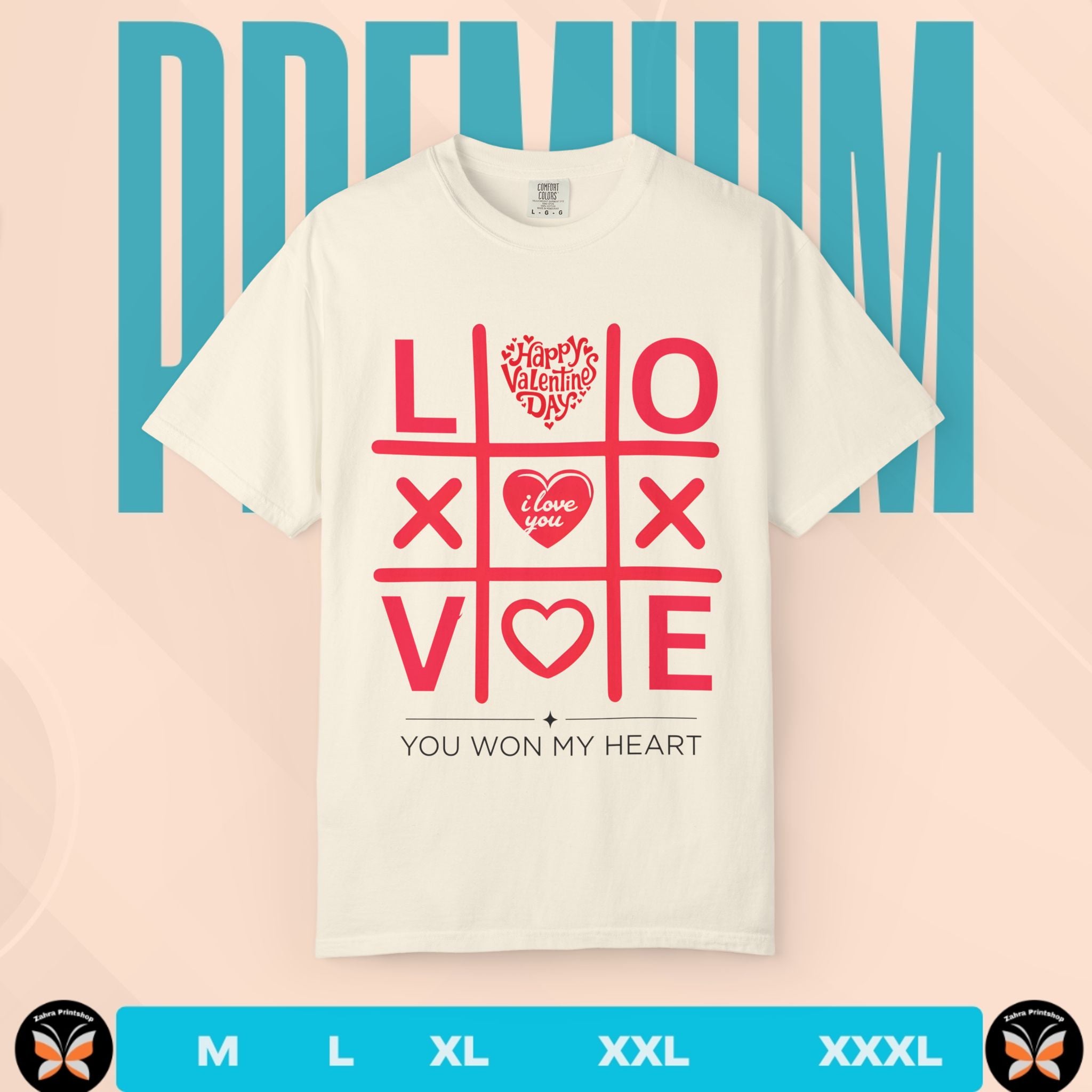 White t-shirt with red Valentine's Day-themed design on a pink and blue striped background