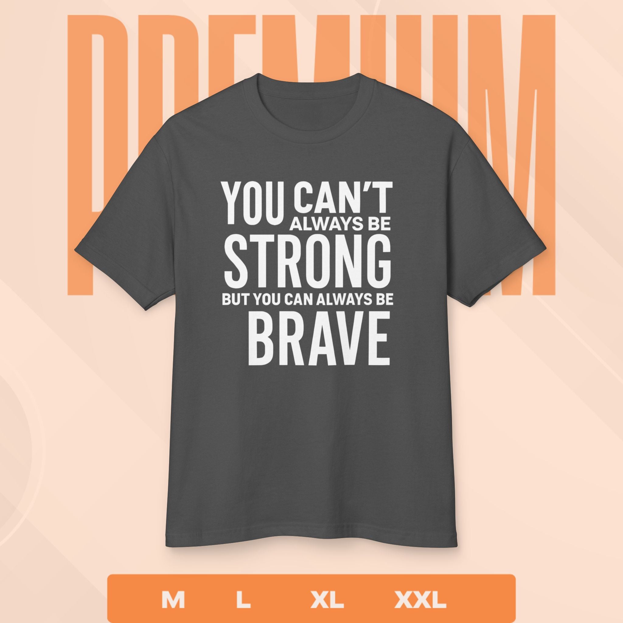 Gray t-shirt with motivational quote on a peach background
