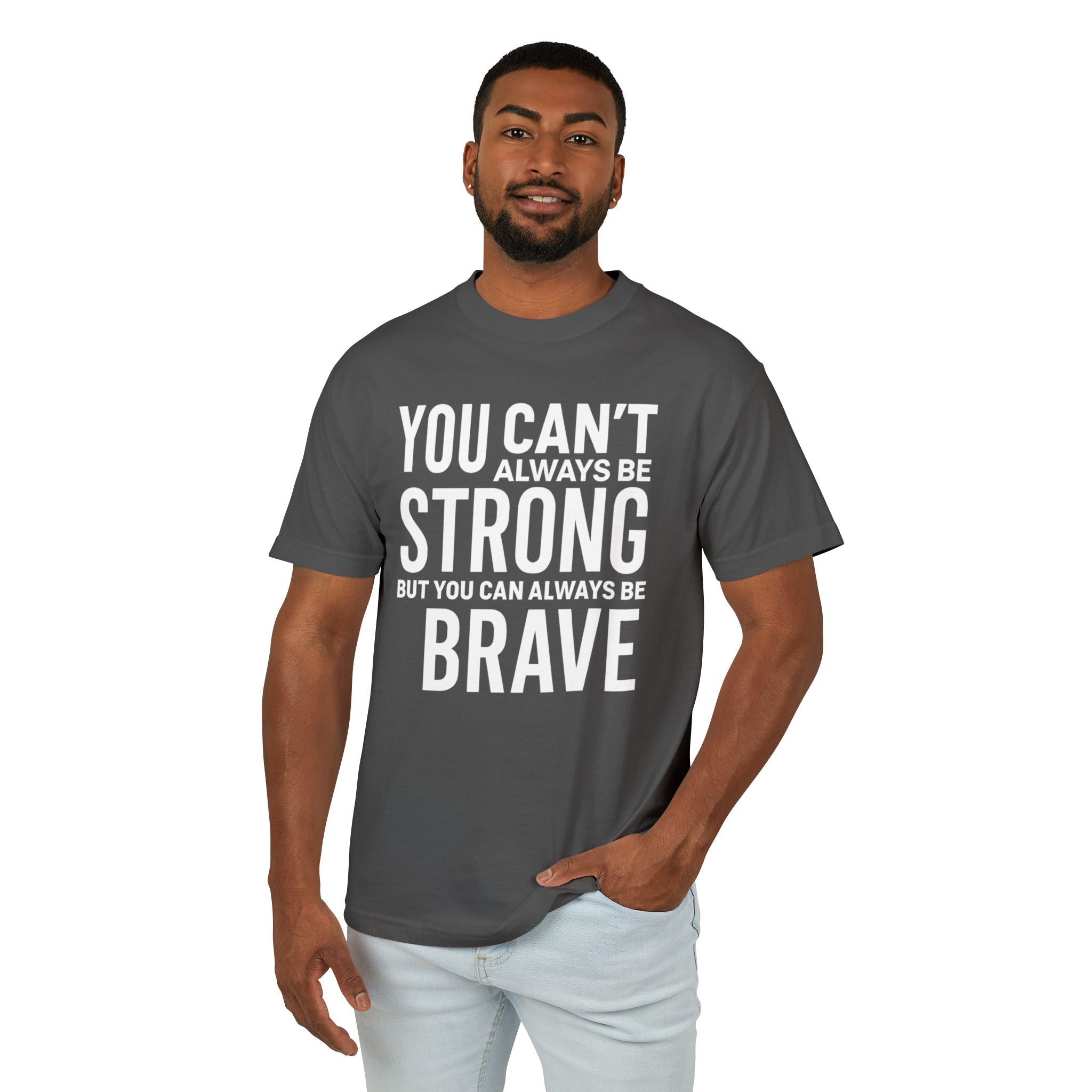 Man wearing a gray t-shirt with motivational quote on a white background