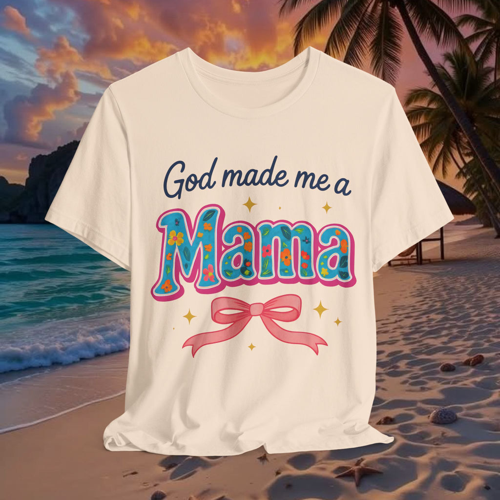 White t-shirt with 'God made me a Mama' text on a beach at sunset
