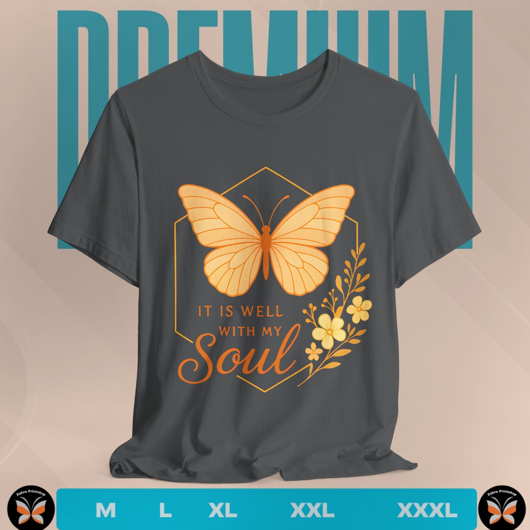 Gray t-shirt with orange butterfly and floral design on a beige background