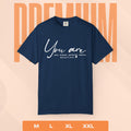 Navy blue t-shirt with motivational quote on a peach background