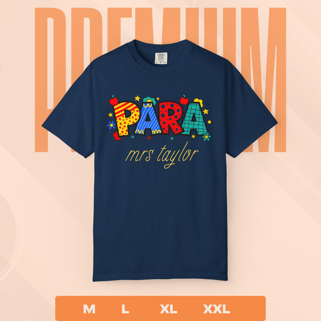 Navy blue t-shirt with colorful text ' PARA mrs taylor' on a peach background