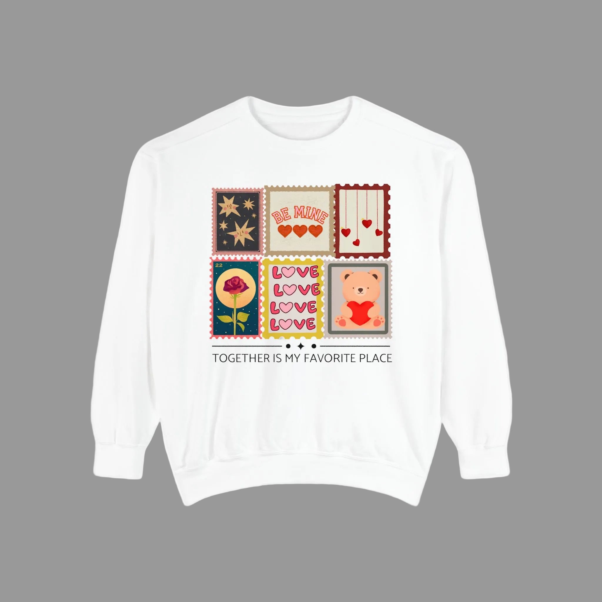 White sweatshirt with colorful graphic design on a white background