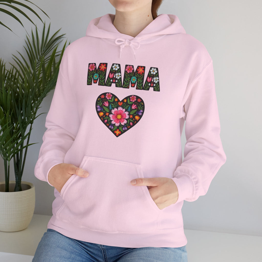 Pink hoodie with floral heart and 'MAMA' text design, worn by a person.