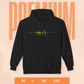 Black hoodie with yellow text on a peach background