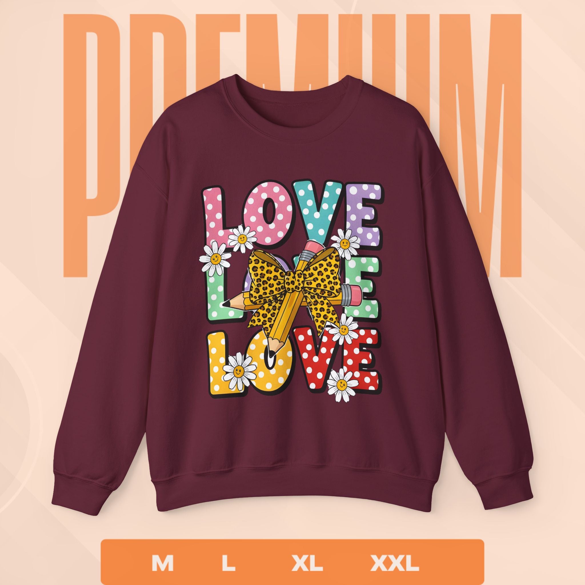 Maroon sweatshirt with colorful 'LOVE' graphic on a peach background