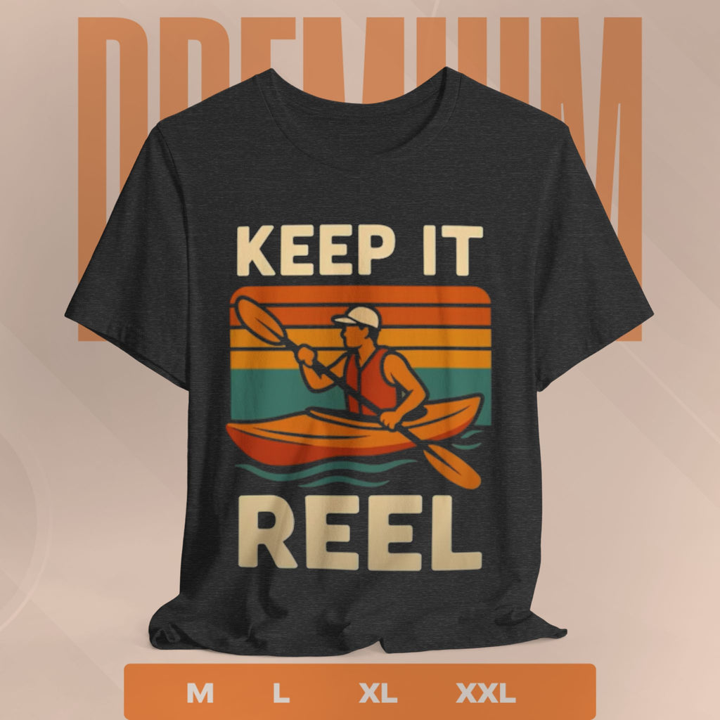 Black t-shirt with a graphic of a person in a kayak and text 'Keep It Reel' on a beige background.