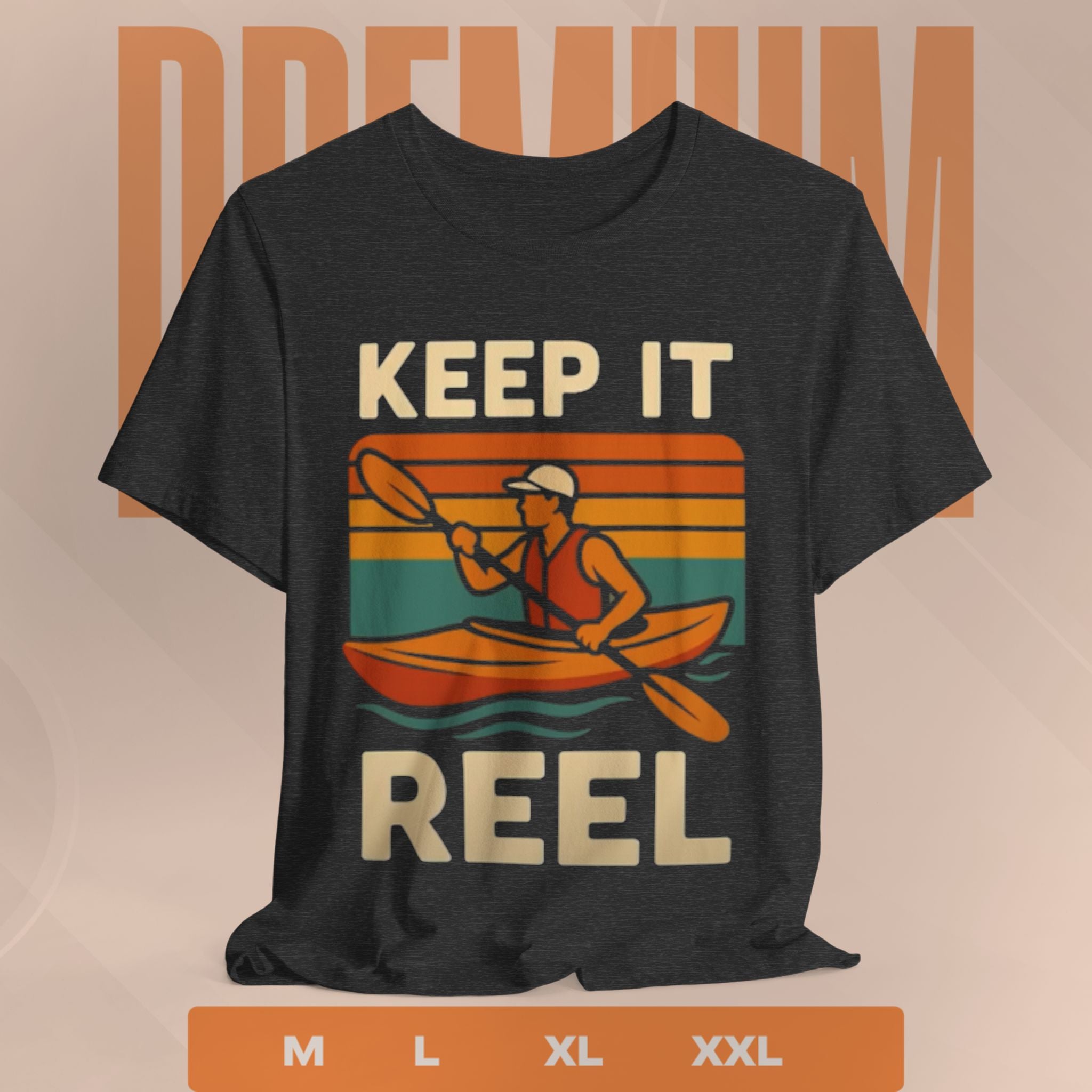 Black t-shirt with a graphic of a person in a kayak and text 'Keep It Reel' on a beige background.