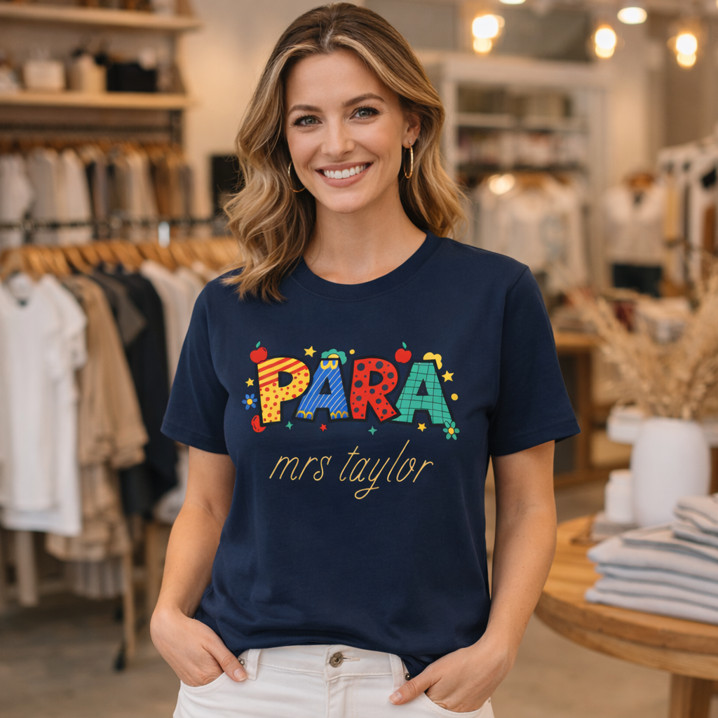 Woman wearing a navy blue t-shirt with colorful text in a store setting